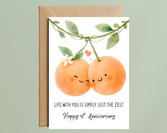 May include: A greeting card with a watercolor illustration of two orange fruits with smiling faces, connected by a green vine with leaves. The card reads "LIFE WITH YOU IS SIMPLY JUST THE ZEST" and "Happy 4th Anniversary."