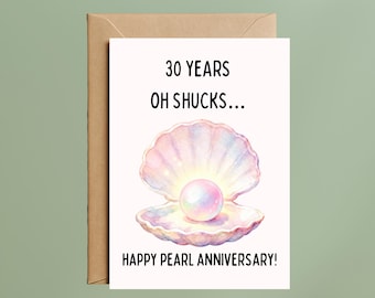 May include: A greeting card with a watercolor illustration of a pearl inside an open seashell. The card reads "30 YEARS OH SHUCKS... HAPPY PEARL ANNIVERSARY!" The card is inside a brown envelope.