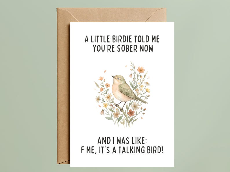 May include: A white greeting card with a brown envelope featuring a watercolor illustration of a small bird perched on a branch surrounded by flowers. The text reads: A LITTLE BIRDIE TOLD ME YOU'RE SOBER NOW AND I WAS LIKE: F ME, IT'S A TALKING BIRD!