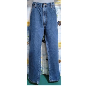 Lata 90., 36W, długość wewnętrzna nogawki 29, stan 11,5. „Autentyczne dżinsy WRANGLER Premium Quality Extra Value Style Comfort” w kolorze niebieskim, proste nogawki, rozporek na suwak