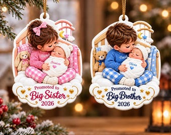 May include: Two hanging ornaments featuring children in pajamas holding infants in swaddles. One ornament says Promoted to Big Sister 2026 with pink accents, the other says Promoted to Big Brother 2026 with blue accents. Both include small teddy bears.