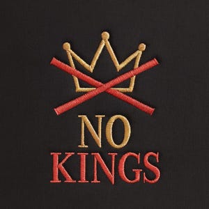 May include: Black fabric with an embroidered design. The design features a gold crown crossed out with red lines, and the words "NO KINGS" embroidered in gold and red thread. The overall theme is a statement against royalty.
