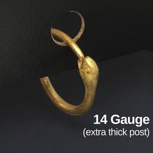 May include: Gold snake hoop earrings with a thick post. 14 Gauge (extra thick post).