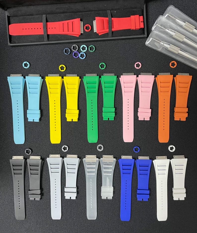 May include: A collection of 12 different colored watch bands, each with a unique design. The bands are made of a durable material and are available in a variety of colors, including red, blue, green, yellow, and black.