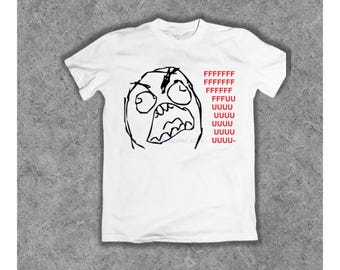 May include: White t-shirt with a black and white illustration of a rage face with the text "FFFFFFF FFFF FFFF FFFUU UUUU UUUU UUUU UUUU UUUU- "