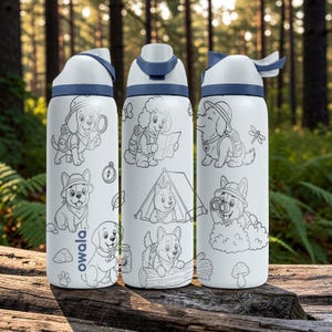 May include: Three white Owala water bottles with blue lids and caps, featuring black line art illustrations of cartoon dogs in explorer gear, including camping, hiking, and nature motifs like mushrooms, leaves, and a compass.