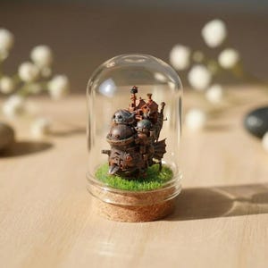 May include: A set of three ceramic mugs with a speckled, matte finish in cream, light grey, and dark grey. Each mug has a minimalist design, ideal for tea or coffee.