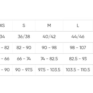 May include: A white size chart with the word "Size" in bold black letters. The chart lists sizes from XXS to 2XL, with corresponding bust, waist, and hip circumference measurements in inches.