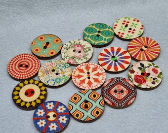 May include: A collection of decorative wooden buttons with various colorful patterns. Designs include floral, geometric, and abstract motifs in shades of red, blue, green, and yellow. Each button has two or four holes for sewing.