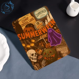 May include: A rectangular Summerween-themed decorative item with a collage of Halloween imagery. The design includes pumpkins, ghosts, a skull, and the text "Summerween" in orange. A purple ghost is featured prominently.