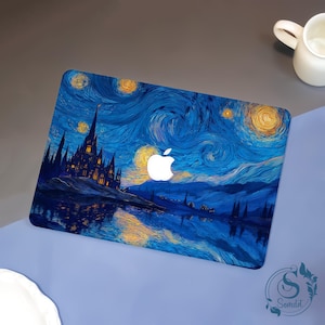May include: A laptop skin featuring a dark blue night sky with swirling patterns, a tall castle silhouette, and glowing yellow stars. The design incorporates a central white Apple logo cutout, creating a contrast against the deep blue tones of the artwork.