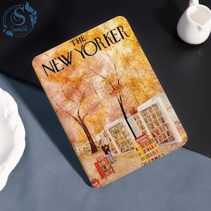 May include: A rectangular item featuring a vintage illustration of a park scene with bookshelves and the text "THE NEW YORKER". The artwork depicts a fall landscape with trees and people browsing books.