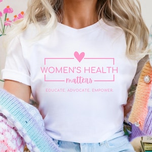 Womens Health Advocacy Shirt | Pink Feminist Healthcare Equality T-Shirt | Women&#39;s Health Activist Gift OBGYN Nurse WHNP CNM Educator Tee