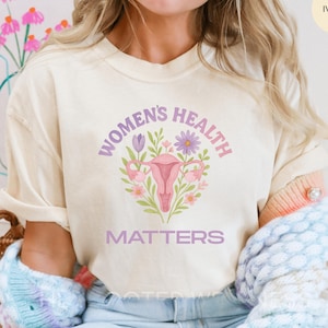Womens Gesundheit Matters Befürwortung Shirt | Aquarell feministische Gleichheit im Erscheinungsbild T-Shirt | Uterus Frauen Aktivistin Geschenk | OBGYN Krankenschwester WHEP Tee