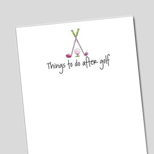 May include: A white notepad with a pink and green golf club illustration and the text "Things to do after golf".