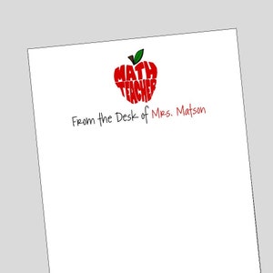 May include: A red apple with the words "MATH TEACHER" written inside. The text "From the Desk of Mrs. Matson" is written below the apple.