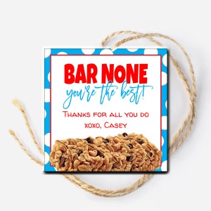 May include: A blue and white polka dot background with a white rectangle. The rectangle has the text "BAR NONE you're the best!" in red and "THANKS FOR ALL YOU DO XOXO, CASEY" in black. A granola bar is pictured below the text.