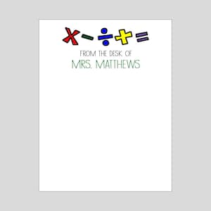 May include: A white notepad with a green border and the text "From the desk of Mrs. Matthews" in green. Above the text are colorful math symbols: a red "x", a green "-", a blue "÷", a yellow "+", and a purple "=".