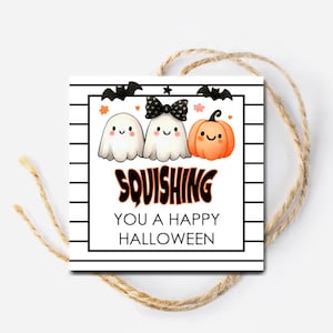 May include: A Halloween-themed gift tag with a black border and a white background with black stripes. The tag features cartoon ghosts, a pumpkin, bats, and the text "Squishing You a Happy Halloween."