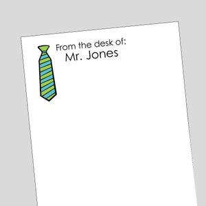 May include: A white notepad with the text "From the desk of: Mr. Jones" and a green and blue striped tie illustration.
