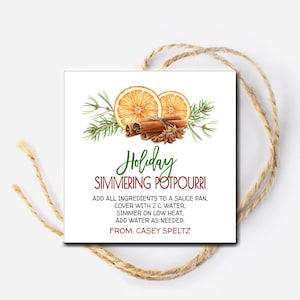 May include: A printable gift tag featuring a watercolour illustration of orange slices, cinnamon sticks and star anise. The text reads "Holiday Simmering Potpourri" and includes instructions for making the potpourri. The tag is from Casey Speltz.