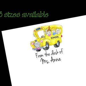 May include: A yellow school bus with three children inside. The bus has the word "LEARN" on the side and "SCHOOL" on the front. The text "From the desk of Ms. Anna" is written below the bus.