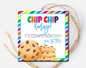 May include: A colorful printable tag with the text "Chip Chip hooray! It's competition day! You got this" and a cartoon image of chocolate chip cookies.