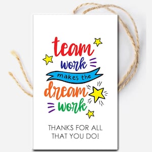 May include: A white card with a colorful design and the text "team work makes the dream work" with stars and a blue ribbon. The card also has the text "Thanks for all that you do!"