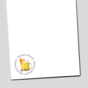 May include: White paper with a circular logo featuring two beer glasses. The logo reads "Rough Drafts" in a blue circular font. One glass is tall and slender, the other is a mug with a handle, both filled with golden beer and white foam.