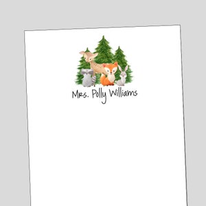 May include: A white notepad with a green, brown, and orange woodland animal illustration and the text "Mrs. Polly Williams".