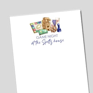 May include: A colorful illustration featuring game night elements. A Jenga tower, playing cards, a game board, and a game piece are displayed. The text "GAME NIGHT at the Spettz house" is also present.