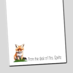 May include: A white notepad with a red fox illustration and the text "From the desk of Mrs. Speltz".