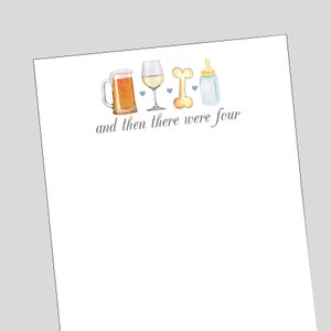 May include: A white notepad with a blue and brown illustration of a beer mug, wine glass, bone, and baby bottle. The text "and then there were four" is written in cursive below the illustration.
