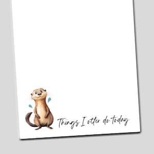 May include: A white notepad with a cartoon otter illustration and the text "Things I otter do today" in black script. The otter is brown with a white belly and blue water droplets.