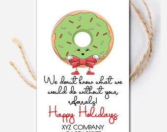 May include: A white gift tag featuring a cartoon donut with green icing and a red bow tie. The tag has the text "We donut know what we would do without your referrals! Happy Holidays."