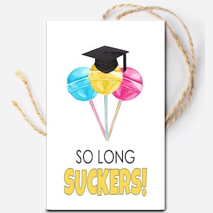 May include: A graduation card with a black graduation cap on top of three lollipops. The lollipops are blue, yellow, and pink. The text on the card says "So Long Suckers!"