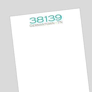 May include: White notepad with a teal blue and green logo that says "38139 GERMANTOWN • TN"