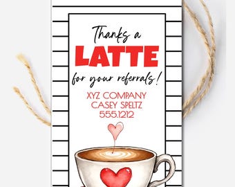 May include: A white gift tag with a black border and a striped background. The tag features the text "Thanks a LATTE for your referrals!" in black and red. A watercolor illustration of a coffee cup with a heart design is at the bottom. A twine string is attached.