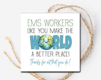 May include: A white square card with the text "EMS WORKERS LIKE YOU MAKE THE WORLD A BETTER PLACE! Thanks for all that you do!" in green and blue. The word "WORLD" features a smiling globe graphic. The card is tied with a natural twine.