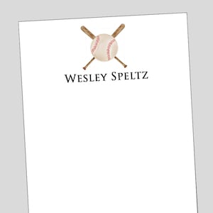 May include: White stationery with a baseball and crossed bats illustration at the top. The baseball is beige with red stitching. The text "WESLEY SPELTZ" is printed in black below the baseball graphic.