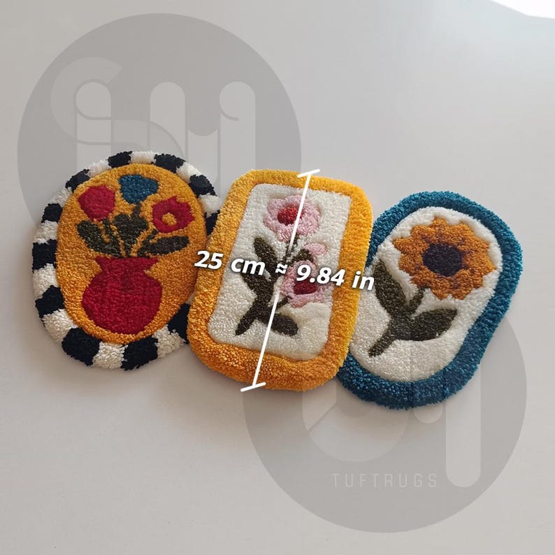 May include: Three colorful tufted rugs with floral designs. The rugs are oval and rectangular shaped. The rugs are approximately 9.84 inches in diameter. The text "TUFT RUGS" is visible in the bottom right corner of the image.