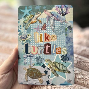 May include: A rectangular card featuring various illustrations of turtles in shades of green, brown, and blue. The text "I like turtles" is prominently displayed. Decorative elements include starfish and a bow.