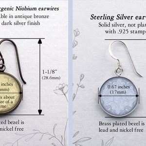 May include: Two earrings are displayed, one with antique bronze Niobium earwires and the other with Sterling Silver earwires. Both have a round design, 0.67 inches (17mm) in diameter, with a brass-plated bezel. The earrings are 1-1/8" (28.6mm) and 1-5/16" (33.3mm) long.
