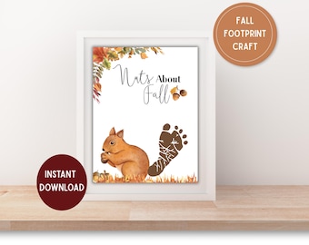 Puede incluir: Una impresión enmarcada con una ilustración de acuarela de una ardilla sosteniendo una nuez, una huella y el texto "Nuts About Fall". La impresión también incluye el texto "Descarga instantánea" y "Fall Footprint Craft".