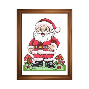 May include: A framed cross-stitch of Santa Claus in a red suit with a white beard and hat. He stands on green grass with red and yellow mushrooms. The image is in a brown wooden frame, perfect for Christmas decor.