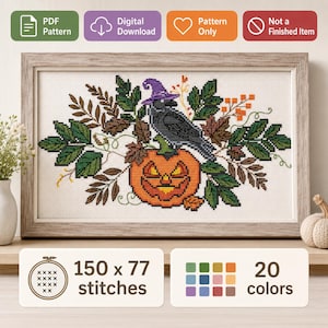 May include: Cross-stitch pattern featuring a black crow wearing a purple witch hat perched on an orange jack-o'-lantern. The design includes green leaves, brown foliage, and orange berries. The pattern requires 150 x 77 stitches and 20 colors.