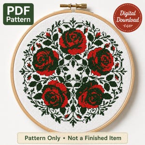 May include: A cross-stitch pattern featuring four red roses with dark green leaves arranged in a circular mandala design, displayed in a wooden embroidery hoop. The image includes text labels reading PDF Pattern, Digital Download, and Pattern Only.
