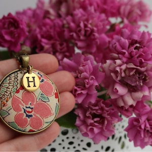 Add a gold initial charm - available on any 1.5" wide round domed pendant