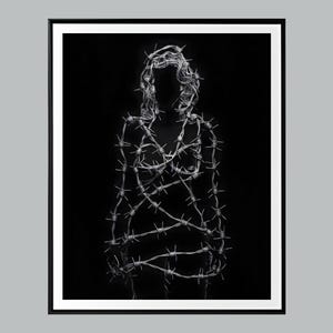 May include: Black and white artwork of a human figure formed from barbed wire. The figure is centered against a black background, framed in a black and white border. The barbed wire is detailed and creates a silhouette.