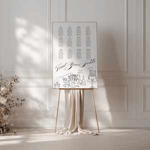 May include: A white rectangular wedding seating chart sign on a gold easel with draped fabric. The sign features the text Find Your Seats, table numbers one through twelve with guest names, and black line illustrations of a cake and table setting.